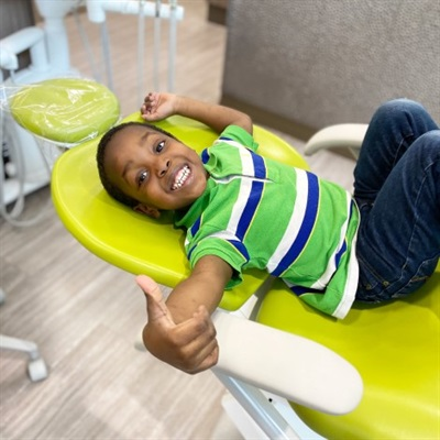 Schedule Kids Dental Appointment Child brushing big teeth