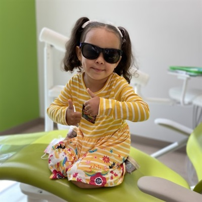 Big Savings on Kids Dental Care Child brushing big teeth