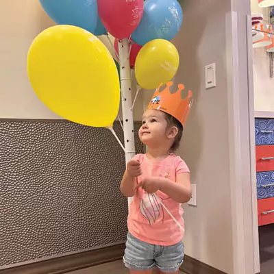 No Dental Insurance Claims Child Holding Ballons